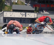 Мойка окон промышленными альпинистами